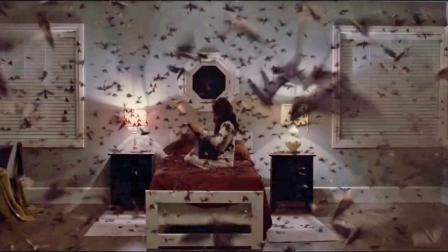 In still from The Possession, actress Natasha Calis is seen sitting on a bed as bats fly around the room. The movie debuted at No. 1 in its opening weekend, pulling in $21.3 million.