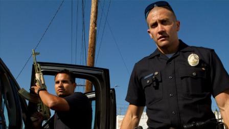 Jake Gyllenhaal (right) and Michael Pena appear in a scene from the 2012 film End of Watch.