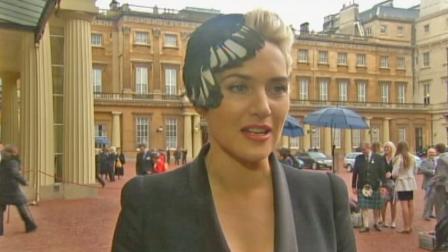 Actress Kate Winslet speaks with media after being given the title of CBE, which stands for Commander of the British Empire.
