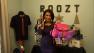 ABC7 Reporter Alysha Del Valle holds up items from Roozt.