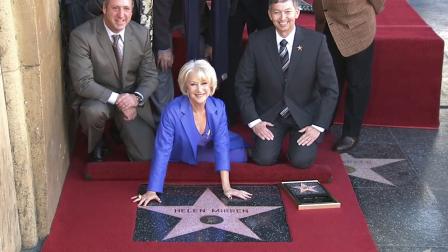 Actress Helen Mirren poses at a ceremony honoring her star on the Hollywood Walk of Fame on Thursday, Jan. 3, 2012.