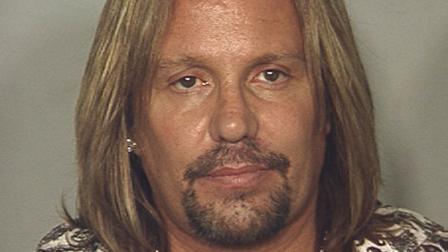 This photo released by the Las Vegas Metropolitan Police Department shows Motley Crue singer Vince Neil, who was arrested in Las Vegas on a drunken driving charge on early Monday, June 28, 2010.