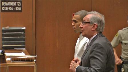 Singer Chris Brown, left, is seen in a Los Angeles courtroom with attorney Mark Geragos, right, on Friday, April 5, 2013.