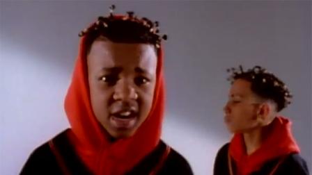 Kris Kross rappers Chris Kelly (left) and Chris Smith (right) appear in a scene from the 1992 music video Jump.