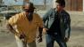 Mark Wahlberg and Denzel Washington appear in a scene from the 2013 film, 2 Guns.