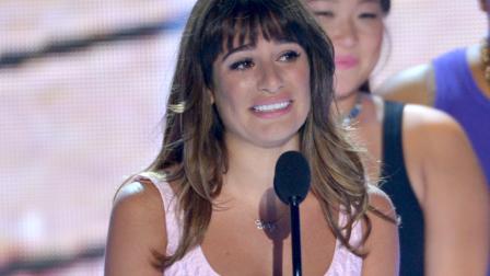 Actress Lea Michele speaks on stage at the Teen Choice Awards at the Gibson Amphitheater on Sunday, Aug. 11, 2013, in Los Angeles.