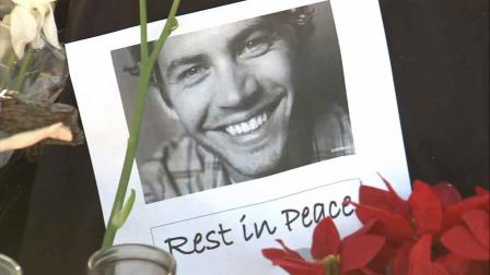 A tribute to Paul Walker is seen in this Dec. 2013 photo. Walker and his friend, Rodger Rodas, were killed in a fiery car crash near Rye Canyon Loop and Kelly Johnson Parkway in Valencia Saturday Nov. 30, 2013.