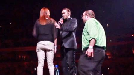 Justin Timberlake helps a fan propose to his girlfriend on stage at a concert in Louisville, Ky.