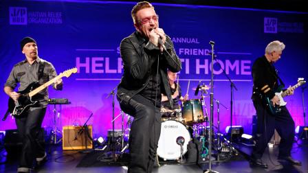 From left, The Edge, Bono, and Adam Clayton of U2 perform on stage at the 3rd Annual Sean Penn & Friends HELP HAITI HOME Gala on Saturday, Jan. 11, 2014 at the Montage Hotel in Beverly Hills, Calif.