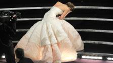 Jennifer Lawrence tripped on her giant dress as she walked on stage to accept the award for best actress in a leading role for Silver Linings Playbook.