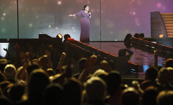 Oprah Winfrey acknowledges fans during a...