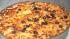 Jason Harley makes his signature pizzas with tomato, lemongrass, carmelized onions, crispy ginger garnish and some roasted butternut squash.  