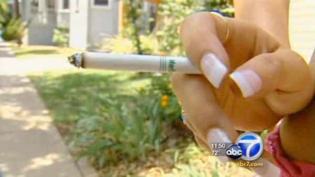 A woman is seen smoking a cigarette in this file photo.