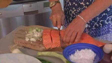 Salmon is prepared for cooking in this undated file photo.