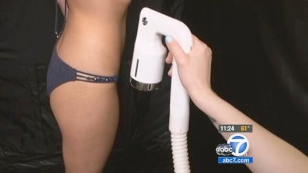 A woman gets a spray tan in this undated file photo.