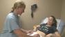 A woman undergoes a pregnancy examination in this file photo from Monday, Dec. 3, 2012.