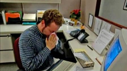 A man is seen sneezing in this undated file photo.