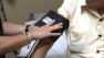 A patient gets his blood pressure measured  in this undated file photo.