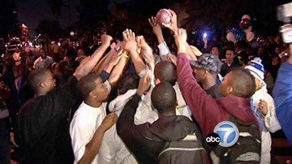Vigil for slain football star