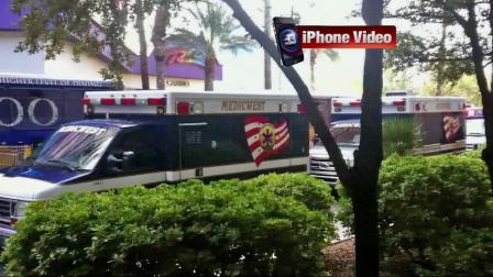 Ambulances are seen outside the Rio Hotel and Casino in Las Vegas on Friday, Nov. 29, 2013, after a group of young football players were sickened.