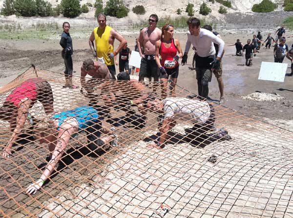 Tough Mudder participants transition from one obstacle to another during the event in Running Springs on Saturday, July 7, 2012.