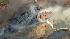 Firefighters battle a fast moving brush fire...