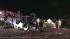 A racing truck is seen on its top after losing...
