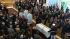 A pastor ushers in the casket of former first...