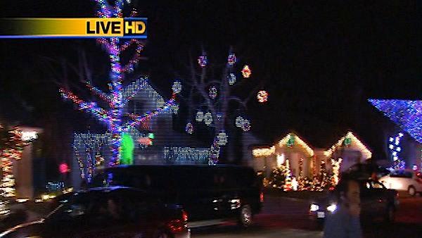 13 homes displays thousands of lights synced to music as part of an annual holiday light attraction on Bainbridge Circle in Murrieta.