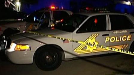Authorities investigate the scene of a deadly shooting in Highland on Wednesday, March 28, 2012.