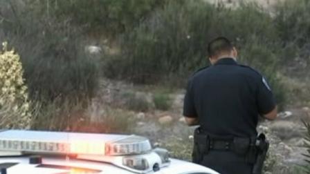 An official investigates in San Bernardino, where badly decomposed remains were found on Tuesday, April 10, 2012.
