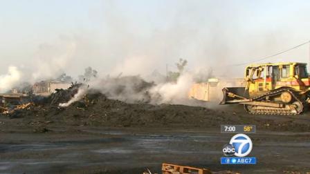 Smoke rises from the remains of a building fire in Fontana on Sunday, May 20, 2012.