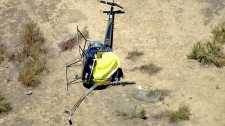 A helicopter is seen following a crash near Lake Skinner on Monday, July 9, 2012. Two people were on board; one died and the other had minor injuries.