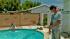 Simi Valley copes with summer heat wave :: Scott Harding, right, of Simi Valley stands poolside at his home during a summer heat wave on Tuesday, July 10, 2012.