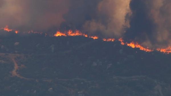 A large brush fire burns in Aguanga, just east of Temecula, on Tuesday, Aug. 14, 2012. Several homes were evacuated and some structures were damaged.