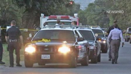 San Bernardino police are shown at the scene of an officer-involved shooting, where a man holding a knife was injured after being shot by a San Bernardino officer on Saturday, Sept. 8, 2012.