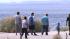 Visitors walk along the shore of the Salton Sea on Monday, Sept. 10, 2012.
