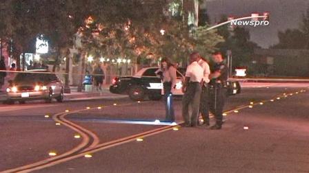 Investigators search the scene of a shooting near a Greyhound station on the 700 block of West Sixth Street on Saturday, Sept. 29, 2012.