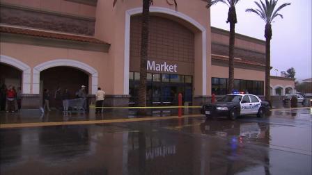 A police vehicle parks outside a Wal-Mart Supercenter in Moreno Valley, where a possibly-armed man was seen on Monday, Dec. 24, 2012.