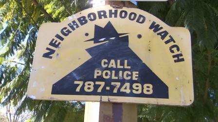 A neighborhood watch sign is shown in a community in Riverside.