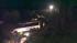 Rescue crews work at the scene of a deadly bus...