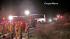 Rescue crews work at the scene of a deadly tour...