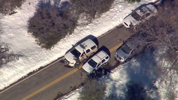Authorities are seen in the Big Bear area on Tuesday, Feb. 12, 2013, following a possible Chris Dorner sighting.