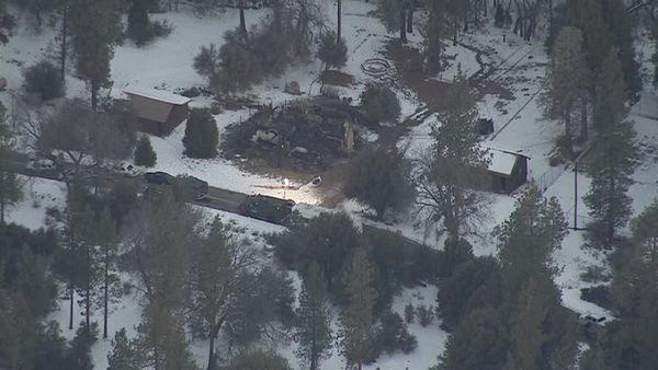 The rubble of a burned cabin in Angelus Oaks is shown in this AIR7 HD still image on Wednesday, Feb. 13, 2013.