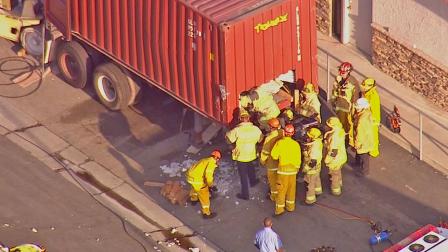 Rescue officials help a construction worker who was trapped under several tons of granite in Fontana. The worker was treated for leg injuries.