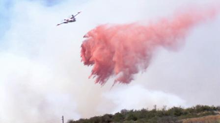 An aircraft drops fire retardant on the Summit Fire in Banning in Riverside County in this May 2013 photo.