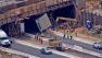 A big rig struck an overpass and got stuck underneath it on the 215 Freeway in Perris on Tuesday, July 9, 2013.