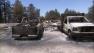 Charred trucks are seen after the Mountain Fire near Idyllwild tore through on Wednesday, July 17, 2013.