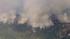 The brush fire in Riverside County burns on...