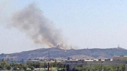 A fire burning south of Beaumont is seen Sunday, Aug. 3, 2013.